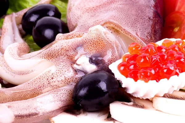Raw squid with vegetables and red caviar — Stock Photo, Image