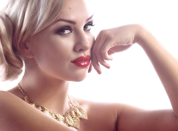 Portrait of a woman with golden necklace — Stock Photo, Image