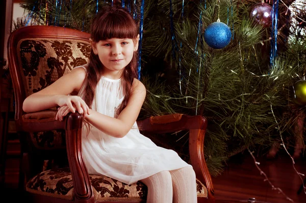 Beautiful little girl with Christmas tree — Stock Photo, Image