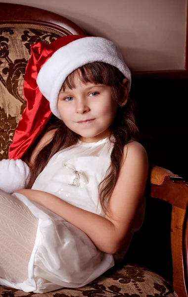 Beautiful little girl in Santa Claus clothes — Stock Photo, Image