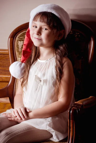 Beautiful little girl in Santa Claus clothes — Stock Photo, Image