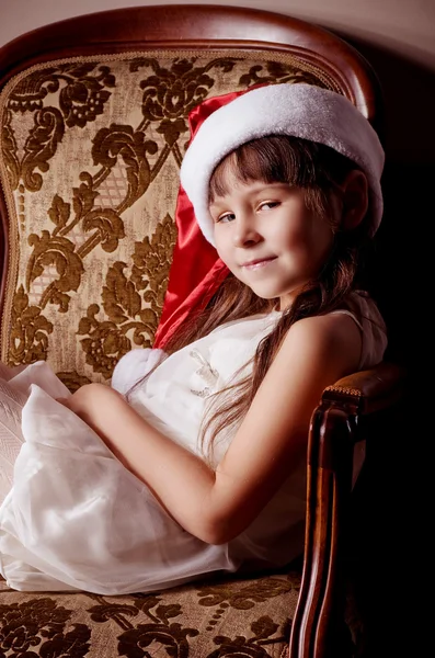 Beautiful little girl in Santa Claus clothes — Stock Photo, Image