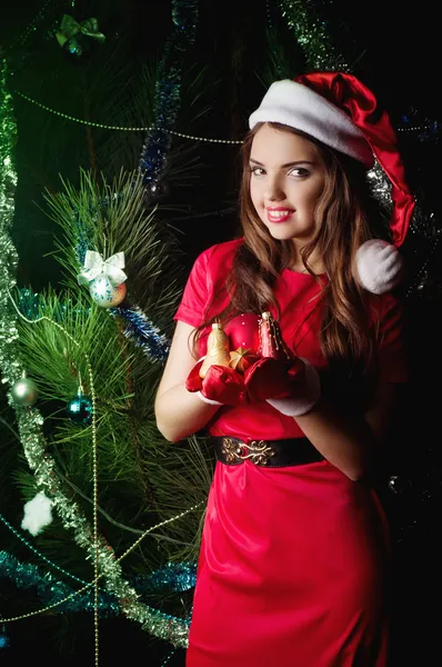 Beautiful young woman in Santa Claus clothes — Stock Photo, Image