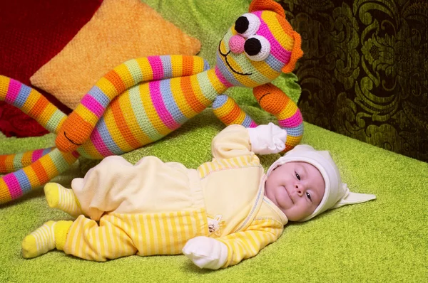 Infant baby with toy cat — Stock Photo, Image