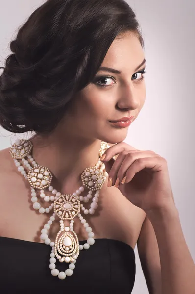 Woman with makeup and with jewelry — Stock Photo, Image