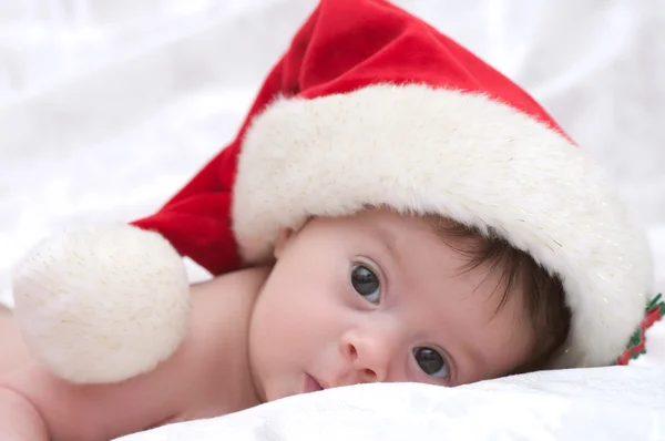 Christmas little cute girl with Santa hat Royalty Free Stock Photos