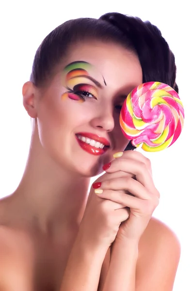 Flicka med spiral lollipop — Stockfoto
