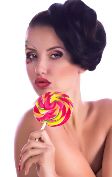 Girl with spiral lollipop — Stock Photo, Image