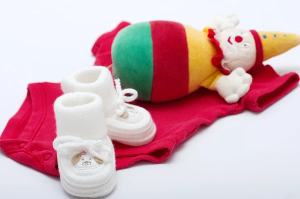 Baby girl colorful clothes with baby boots — Stock Photo, Image