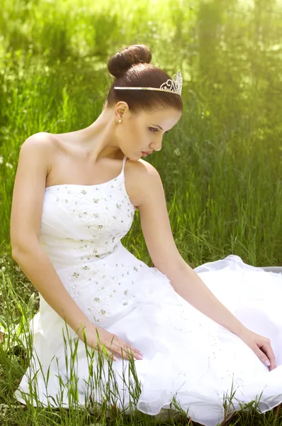 Beautiful young woman in white bridal dress Stock Picture