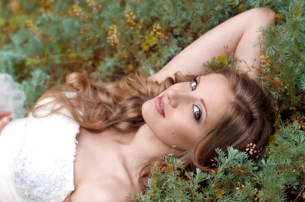 Bride with make-up in white dress — Stock Photo, Image