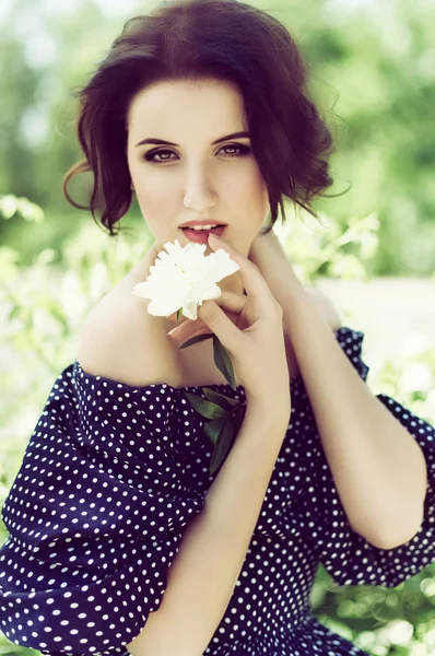 Woman with white flower — Stock Photo, Image