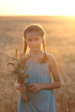girl on a wheat field clipart
