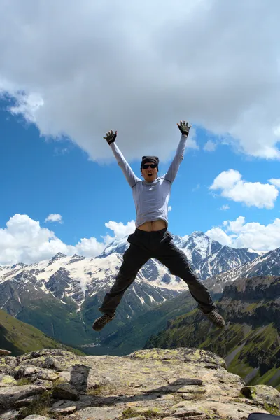 Jumping hiker Stock Picture