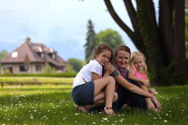 Girls with mother outdoors — Stock Photo, Image