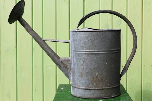 Watering Can Background Wooden Wal — стоковое фото