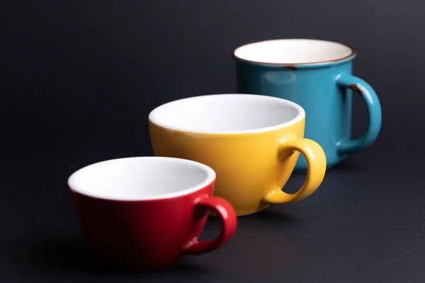 Bright Ceramics Cups Yellow Blue Red Pink Colors Black Backgroun — Photo