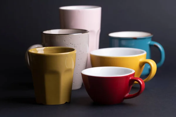 Bright Ceramics Cups Yellow Blue Red Pink Colors Black Backgroun — Fotografia de Stock