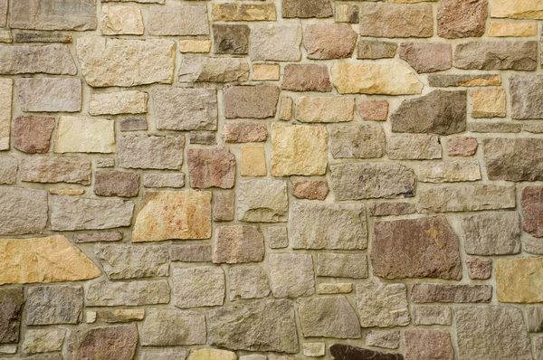 여러 가지 빛깔된의 돌의 벽돌 벽 — 스톡 사진