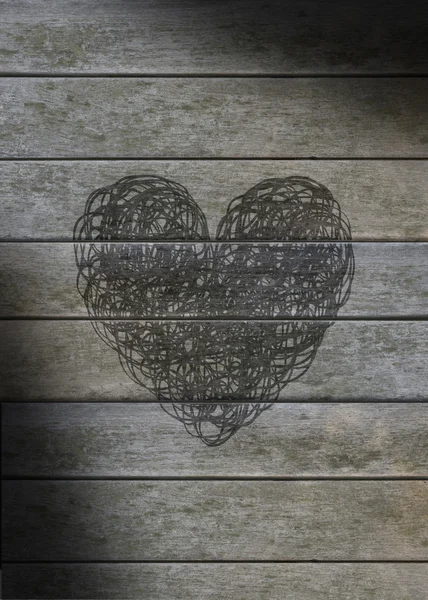 Heart scribbled on a gray weathered wood — Stock Photo, Image