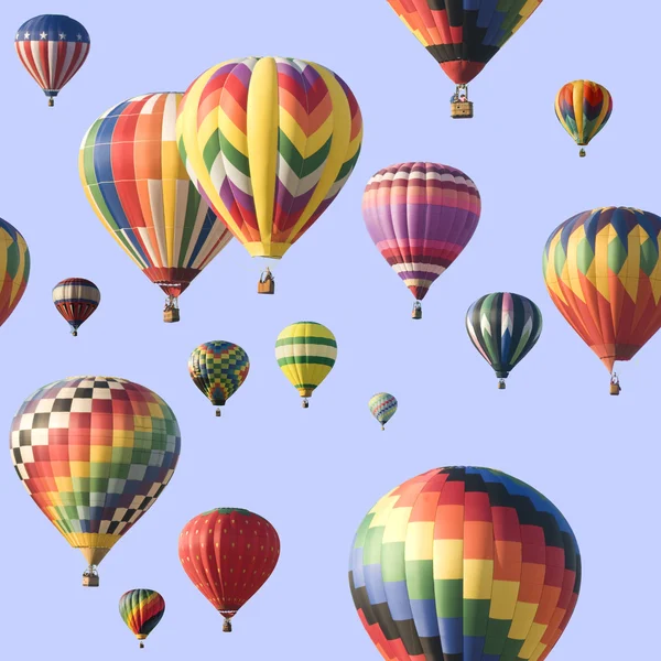 Un grupo de coloridos globos de aire caliente flotando sobre un cielo azul —  Fotos de Stock