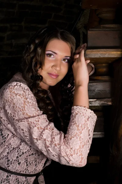 Girl on wooden stairs — Stock Photo, Image