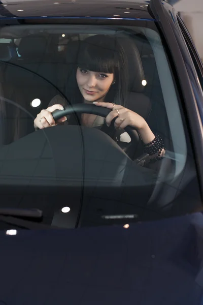 Beautiful brunette in a car — Stock Photo, Image