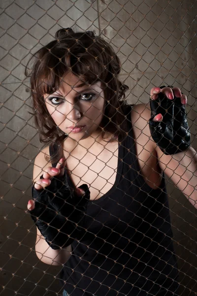 Girl in a cage — Stock Photo, Image