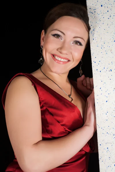 Portrait of a woman in a red dress — Stock Photo, Image