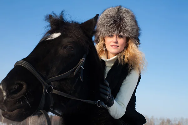 Portrait of a young girl with a horse — Stock Photo, Image