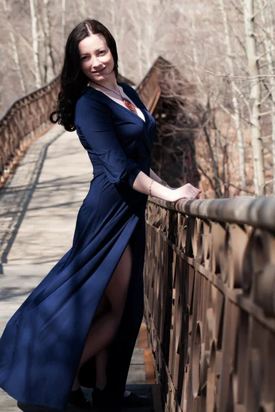 Model on the pedestrian bridge with metal railings — Stock Photo, Image