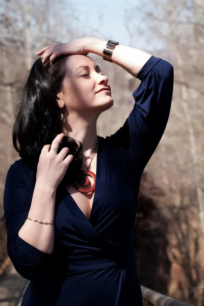 Portrait of a model in an evening dress with a neckline — Stock Photo, Image