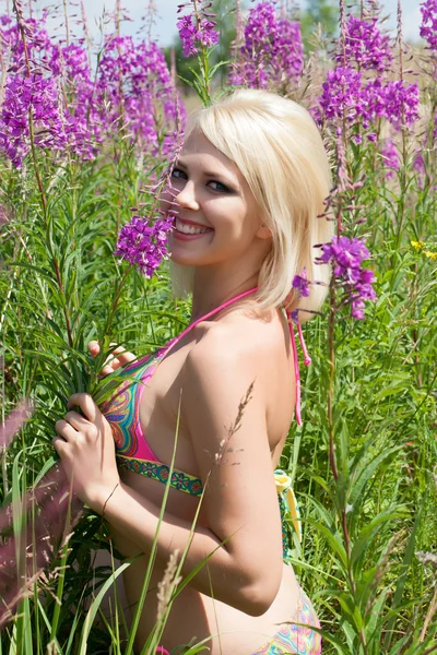Blonde of wildflowers in a bathing suit — Stock Photo, Image