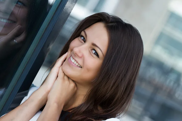 Portrait of a happy young brunette — Stock Photo, Image