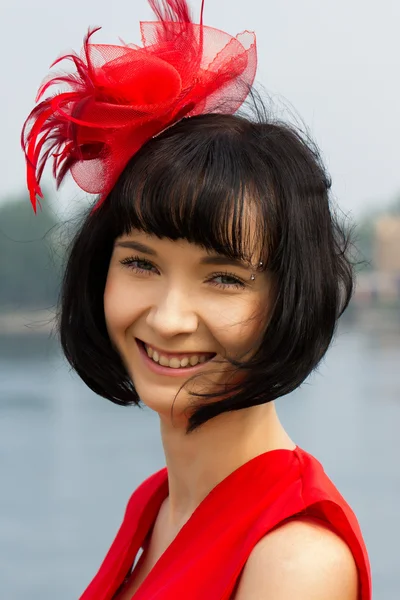 Portrait of a girl with red bow — Stock Photo, Image