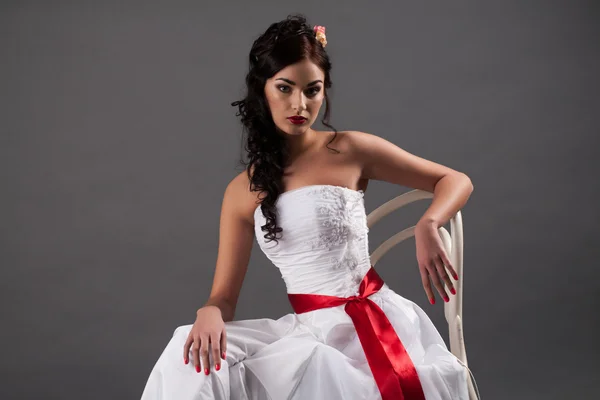 Young bride sitting on a chair — Stock Photo, Image