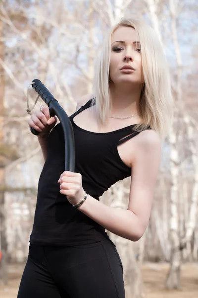 Blonde holding a baton — Stock Photo, Image