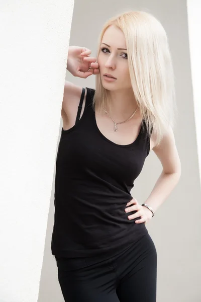 Blonde in a black t-shirt — Stock Photo, Image