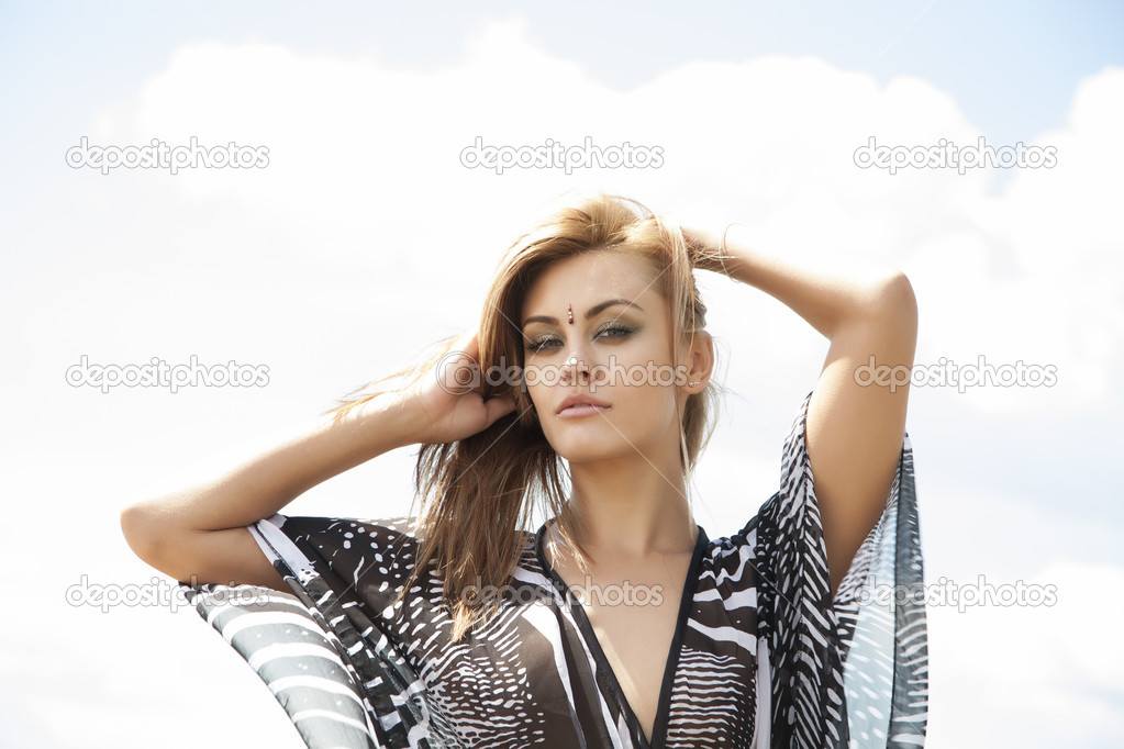 Girl with hair fluttering in the wind