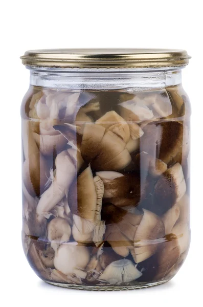 Glass jar with marinated paddy straw mushrooms — Stock Photo, Image