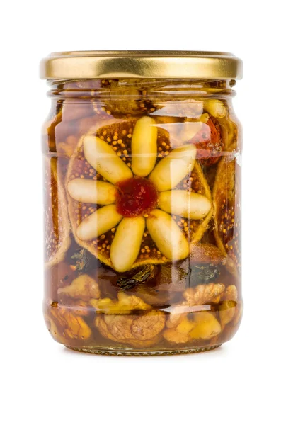 Vaso di vetro pieno di miele, noci e frutta — Foto Stock