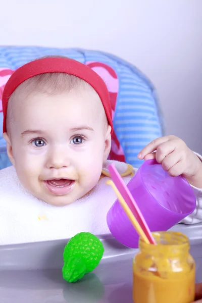 Baby girl eating lunch — Stock Photo, Image