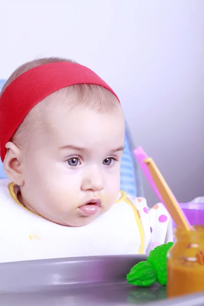 Baby girl eating lunch — Stock Photo, Image