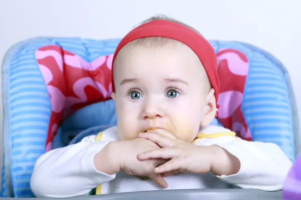 Baby girl eating lunch — Stock Photo, Image