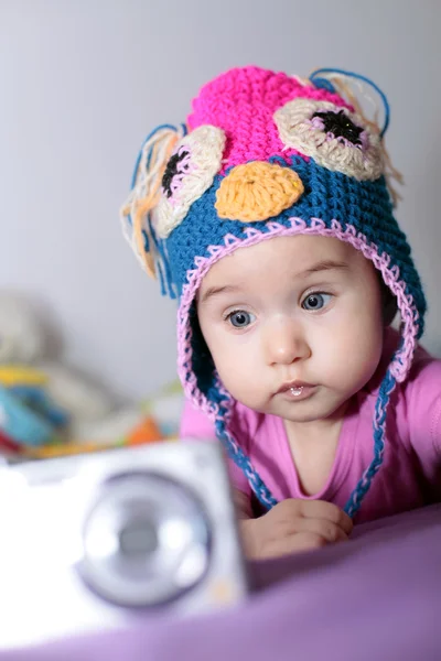 Little girl playing with camera — Stock Photo, Image