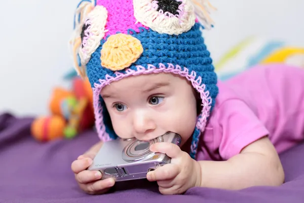 Little girl playing with camera — Stock Photo, Image