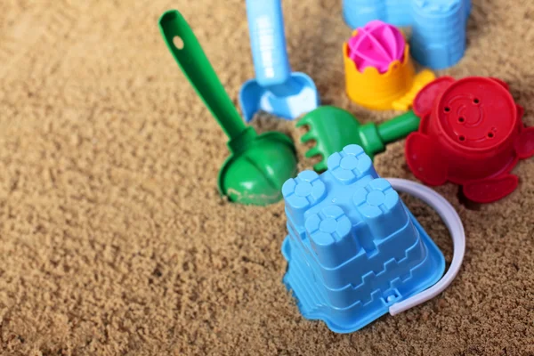 Childrens toys on beach — Stock Photo, Image