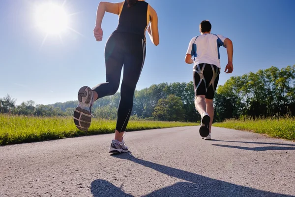 Mladý pár, jogging — Stock fotografie