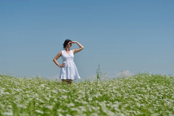 Young happy woman in green field — Stock Photo, Image