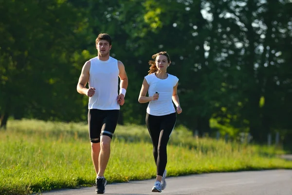 Fiatal pár, jogging — Stock Fotó